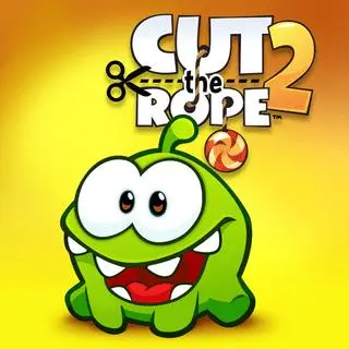 Cut the Rope 2 game - Om Nom the green creature catching candy after ropes are cut, Nommie helpers visible, free browser physics puzzle